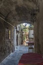 Covered alley and restaurant Old Town Rhodes Royalty Free Stock Photo